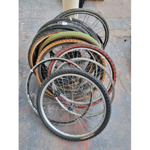 696 - A large collection of various bicycle wheels