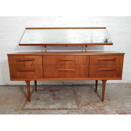 427 - An Austinsuite teak dressing table with six drawers and upper mirror - approx. 117cm high x 151cm wi... 