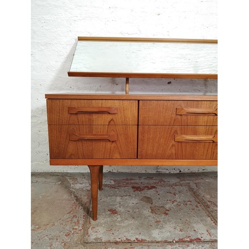 427 - An Austinsuite teak dressing table with six drawers and upper mirror - approx. 117cm high x 151cm wi... 