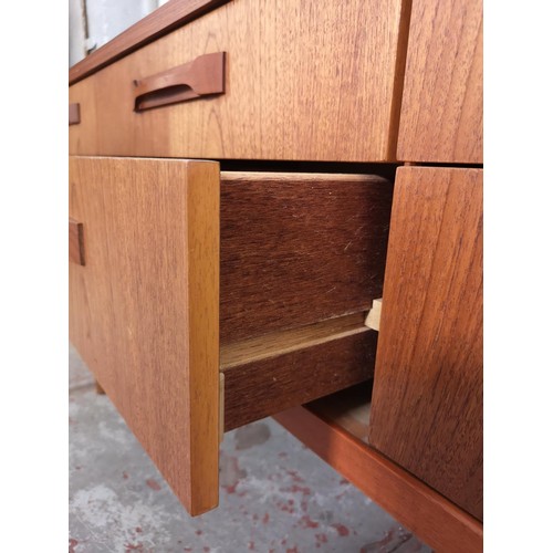 427 - An Austinsuite teak dressing table with six drawers and upper mirror - approx. 117cm high x 151cm wi... 