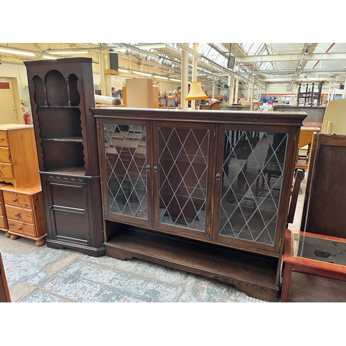 422 - Two pieces of oak furniture, one bookcase with three leaded glass doors and six internal glass shelv... 