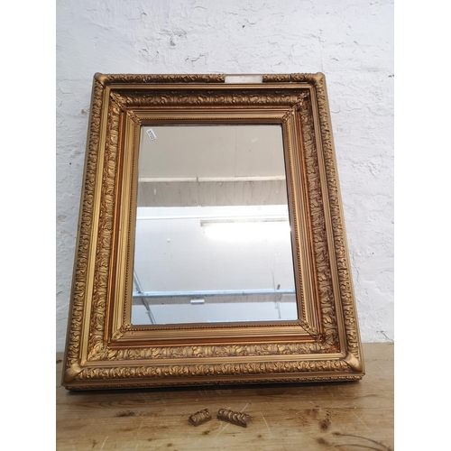 504 - A late 19th/early 20th century gilt framed wall mirror - approx. 61cm high x 50cm wide