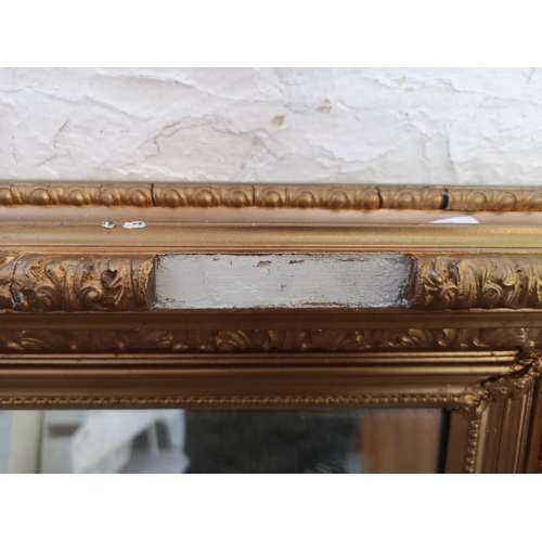 504 - A late 19th/early 20th century gilt framed wall mirror - approx. 61cm high x 50cm wide