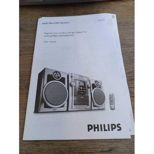 556 - A Philips FWD132 DVD mini hi-fi system with a pair of matching speakers