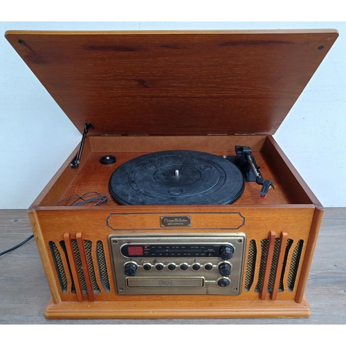 561 - A Vintage Collection MT-GA05 retro style music system comprising three speed turntable, CD player, t... 