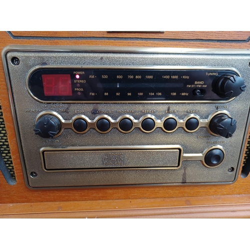 561 - A Vintage Collection MT-GA05 retro style music system comprising three speed turntable, CD player, t... 