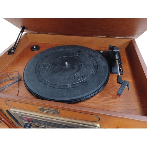 561 - A Vintage Collection MT-GA05 retro style music system comprising three speed turntable, CD player, t... 