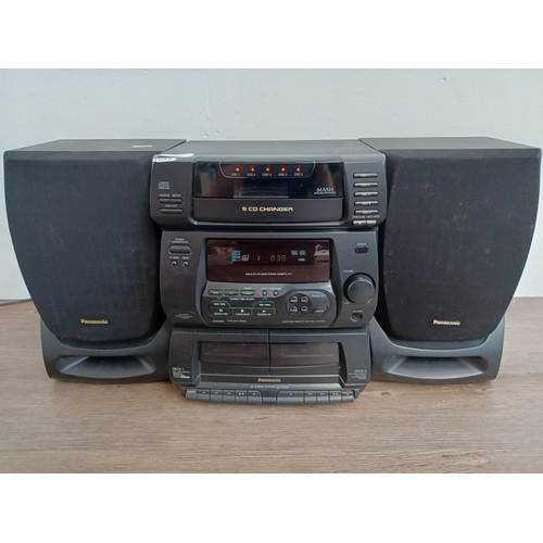 563 - A Panasonic SA-CH34 hi-fi system comprising five CD changer, twin cassette deck and tuner/amplifier ... 