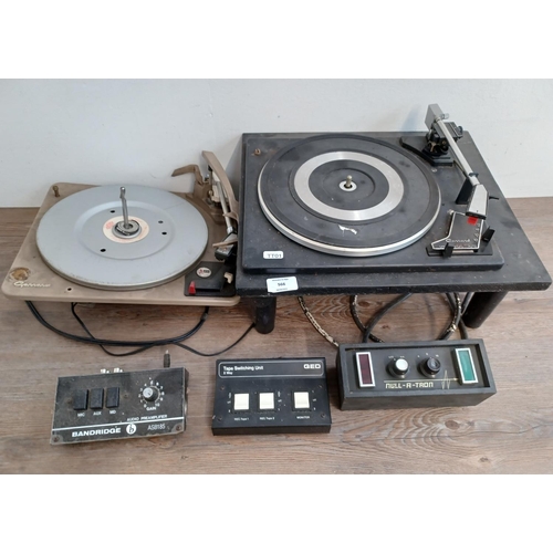 566 - A collection of vintage hi-fi to include Garrard SP25 Mk III three speed turntable, Garrard AT6 four... 