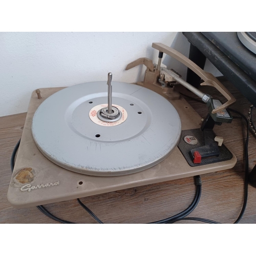 566 - A collection of vintage hi-fi to include Garrard SP25 Mk III three speed turntable, Garrard AT6 four... 