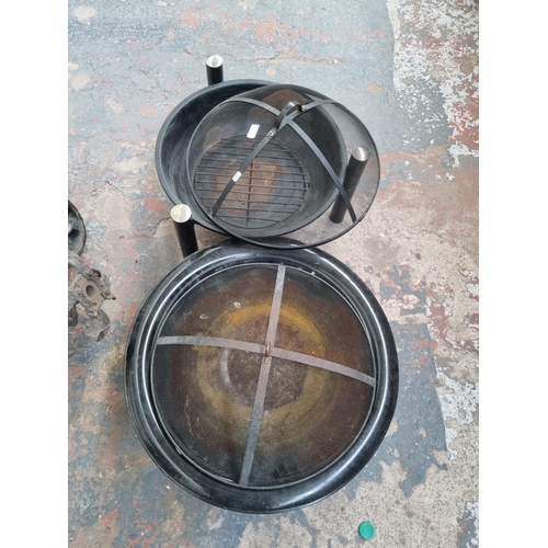 743 - Two metal firepits - largest approx. 50cm high x 55cm diameter