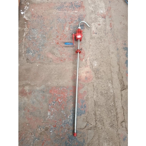 711 - A stainless steel and cast iron utility pump - approx. 128cm long