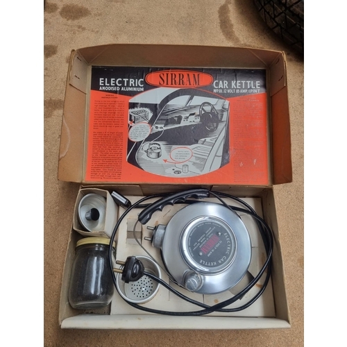 724 - A boxed vintage Sirram electric car kettle