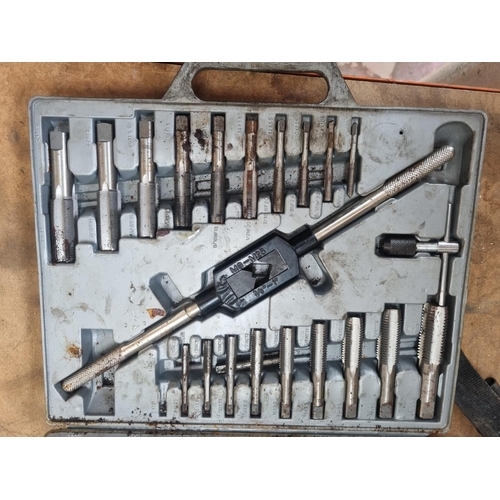 713 - A cased forty three piece tap and die set