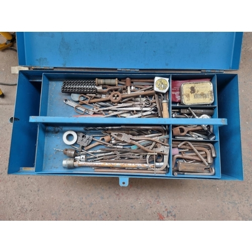 728 - A vintage metal tools chest on castors containing a large collection of various tools