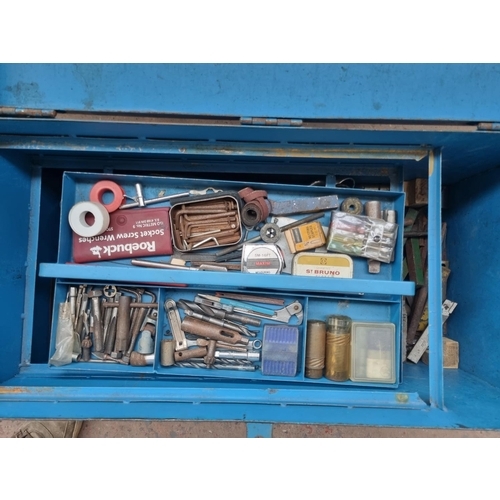 728 - A vintage metal tools chest on castors containing a large collection of various tools