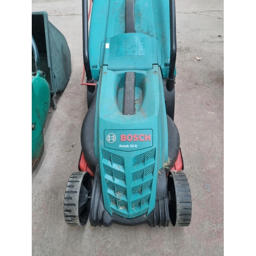 758 - Two lawnmowers, one Bosch Rotak 32R 240V with grass collector and one Qualcast Suffolk Punch 35S pet... 