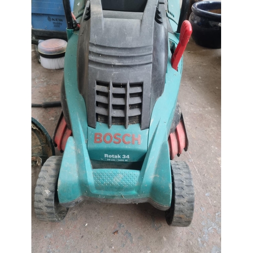 760 - Three items, one Bosch Rotak 34 240V lawnmower with grass collector, one Kew Hobby 3000 pressure was... 