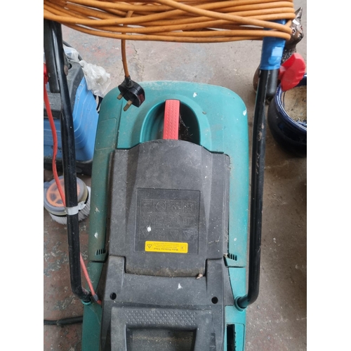 760 - Three items, one Bosch Rotak 34 240V lawnmower with grass collector, one Kew Hobby 3000 pressure was... 