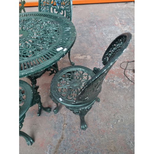 763 - A Victorian style cast aluminium five piece patio set comprising four chairs and one table