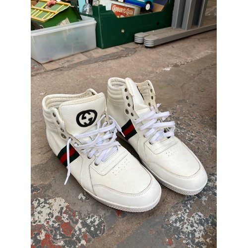 804 - A collection of various items to include a pair of Adidas Superstar size 6 trainers, pair of Nike si... 