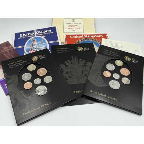 1245 - Twelve various uncirculated coins and coin sets to include 2005 the Menai Bridge, Wales £1 coin, 200... 