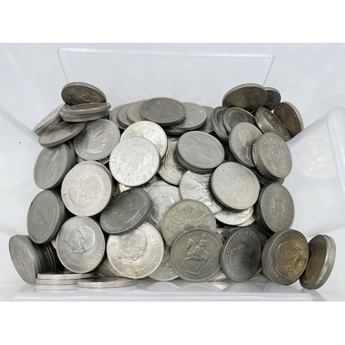 1254 - A large collection of British commemorative coins to include 25 pence, five shillings and five pound... 