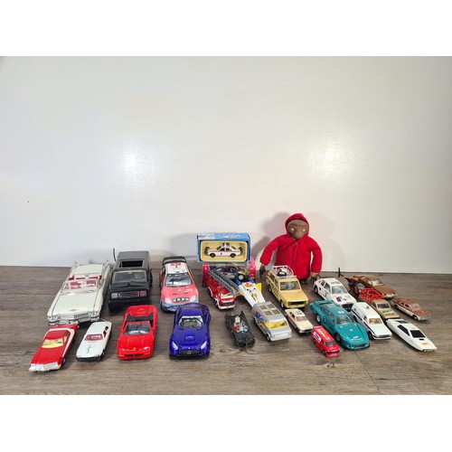 240A - A collection of assorted diecast model vehicles and toys to include Maisto 1959 Cadillac, Team Tonka... 