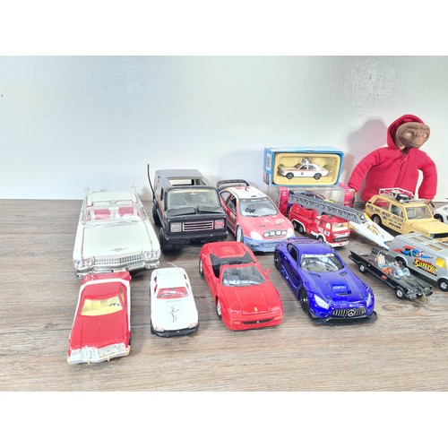 240A - A collection of assorted diecast model vehicles and toys to include Maisto 1959 Cadillac, Team Tonka... 