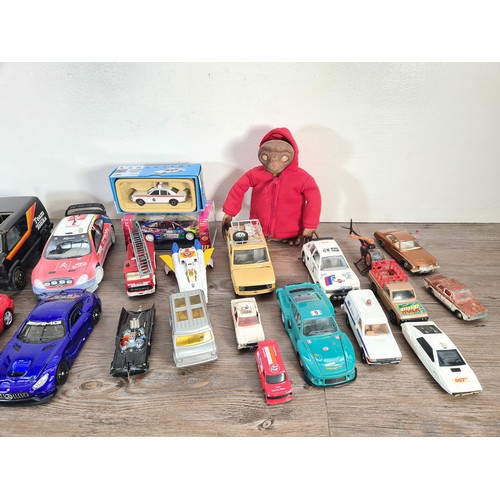 240A - A collection of assorted diecast model vehicles and toys to include Maisto 1959 Cadillac, Team Tonka... 