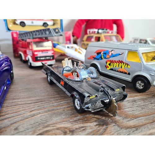 240A - A collection of assorted diecast model vehicles and toys to include Maisto 1959 Cadillac, Team Tonka... 