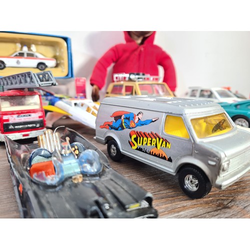 240A - A collection of assorted diecast model vehicles and toys to include Maisto 1959 Cadillac, Team Tonka... 