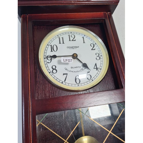 322A - Two quartz wall clocks, one Constant Westminster chime with pendulum - approx. 50cm high and one Spi... 