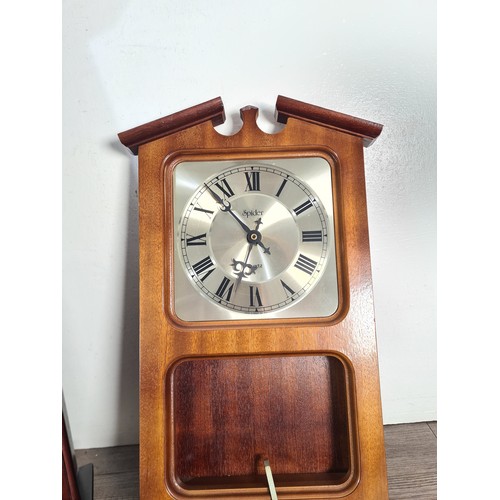 322A - Two quartz wall clocks, one Constant Westminster chime with pendulum - approx. 50cm high and one Spi... 