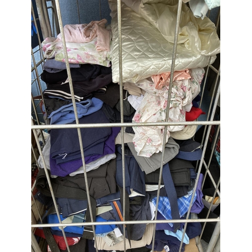 771B - Three cages containing a large quantity of clothing and materials (cages not included)