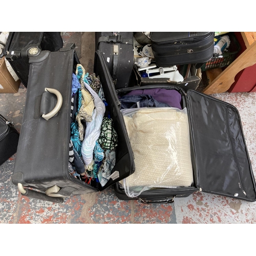 791 - Two boxes and seven suitcases containing assorted house clearance items to include Weylux weighing s... 