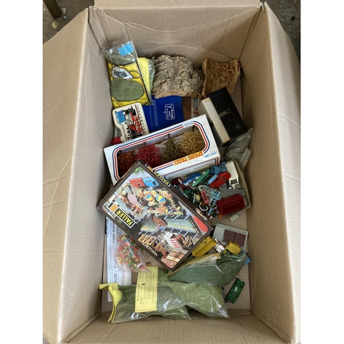 795 - A box containing various model railway building accessories and plastic model vehicles