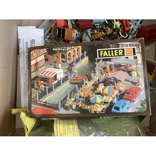 795 - A box containing various model railway building accessories and plastic model vehicles