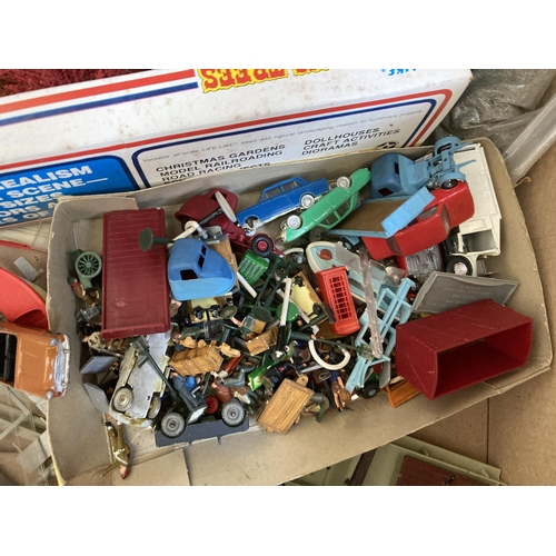 795 - A box containing various model railway building accessories and plastic model vehicles