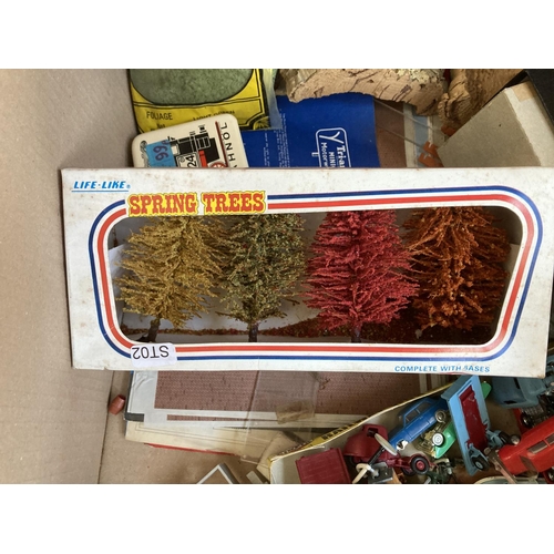 795 - A box containing various model railway building accessories and plastic model vehicles