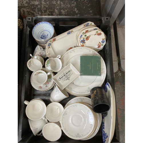 799 - Three boxes containing house clearance items to include Moorcroft Pottery circular trinket dish - ch... 