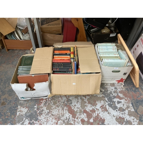 800 - Three boxes containing a large quantity of books to include Penguin books, John Long fictional crime... 