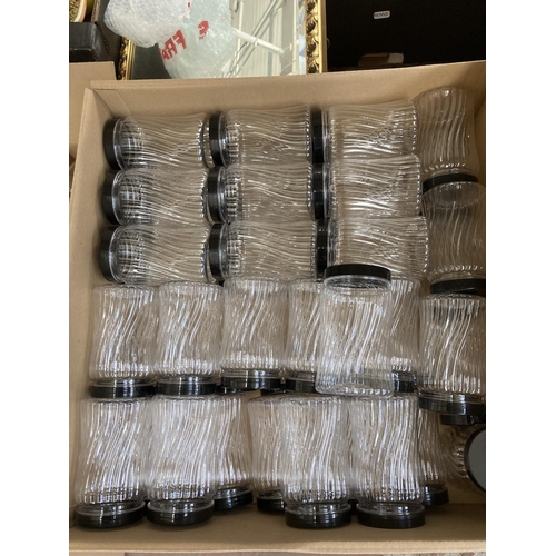 816 - Thirteen boxes containing a large quantity of plastic storage jars