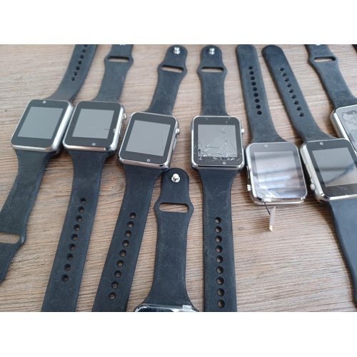 590 - A bag containing a large quantity of unbranded smart watches