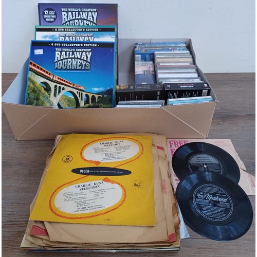 593 - A box containing a collection of DVDs, CDs, vinyl and shellac records - see images for titles