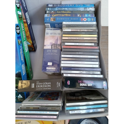 593 - A box containing a collection of DVDs, CDs, vinyl and shellac records - see images for titles