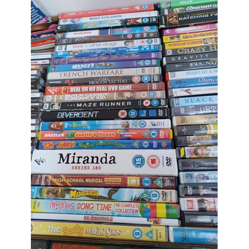 594 - A box containing a collection of DVDs and CDs - see images for titles