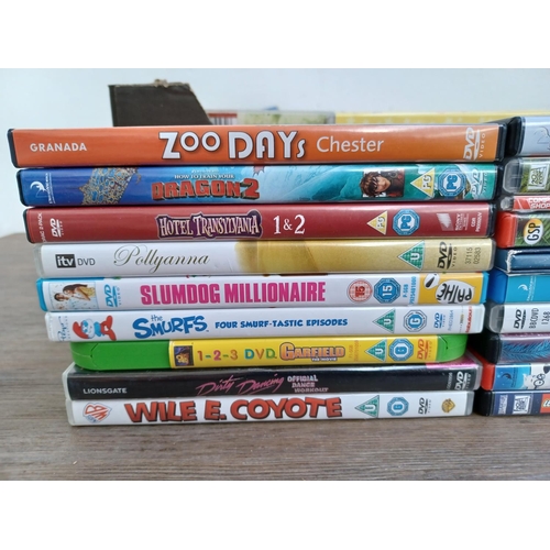 594 - A box containing a collection of DVDs and CDs - see images for titles