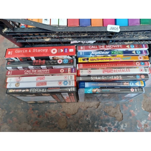 597 - A box containing a collection of DVDs and DVD boxsets - see images for titles