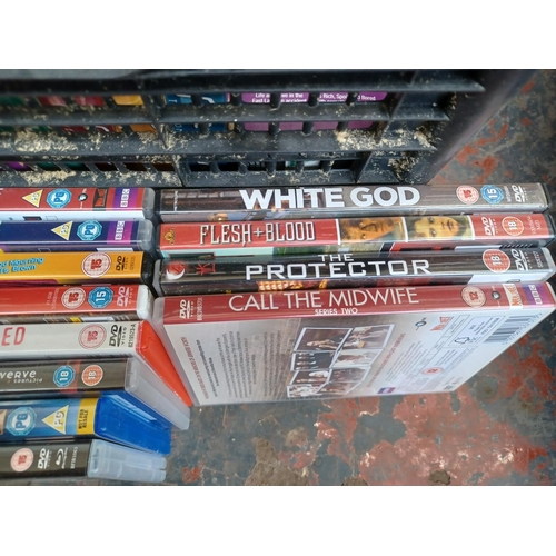 597 - A box containing a collection of DVDs and DVD boxsets - see images for titles